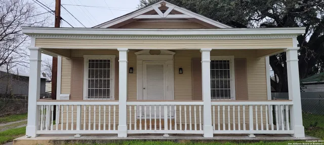 a view of a house with a small yard