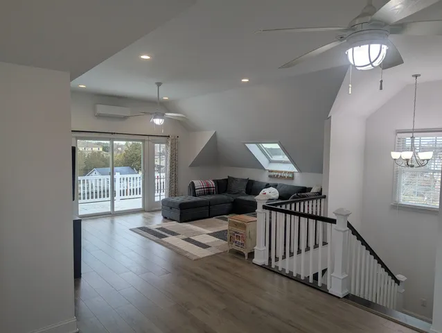 a view of a livingroom with furniture and a flat screen tv
