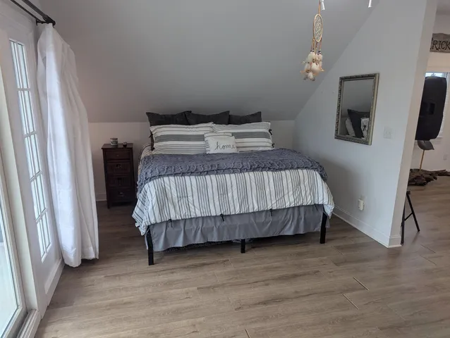 a bathroom with a shower and a sink