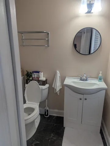 a view of swimming pool with outdoor seating and lake in back