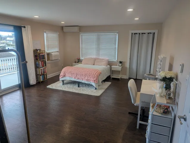 a white toilet sitting next to a shower curtain