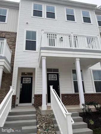 a front view of a house with stairs