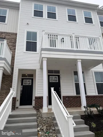 a front view of a house with stairs
