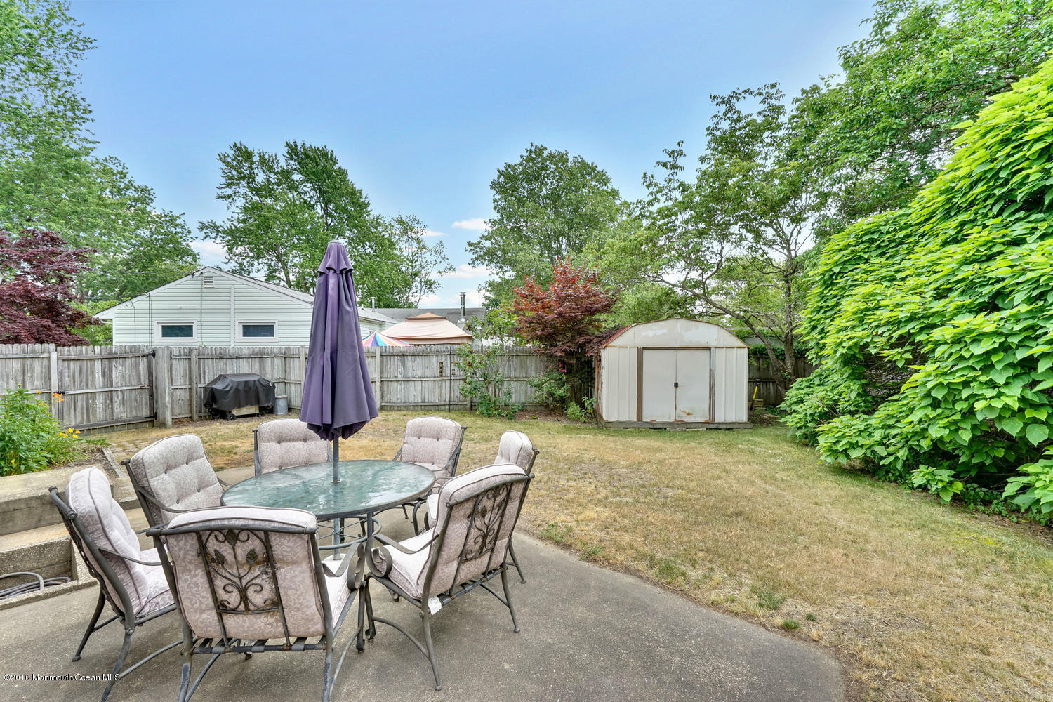 315 Stinson Road Brick, NJ 08723 - Photo 18 of 20 a patio with table and chairs and potted plants