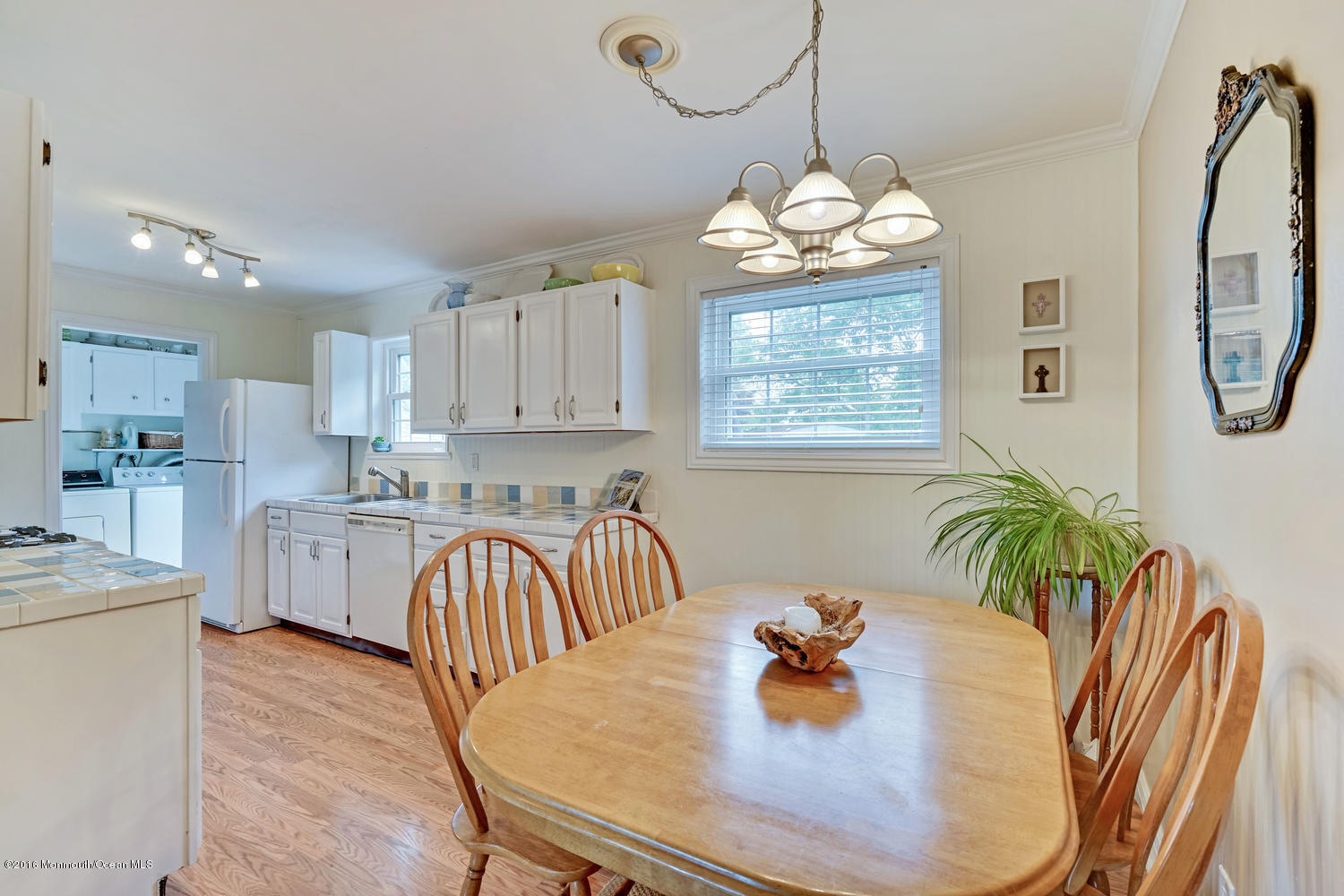 315 Stinson Road Brick, NJ 08723 - Photo 5 of 20 a view of a dining room with furniture a chandelier and wooden floor