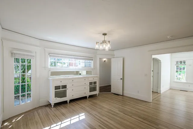 a kitchen with a refrigerator sink and cabinets