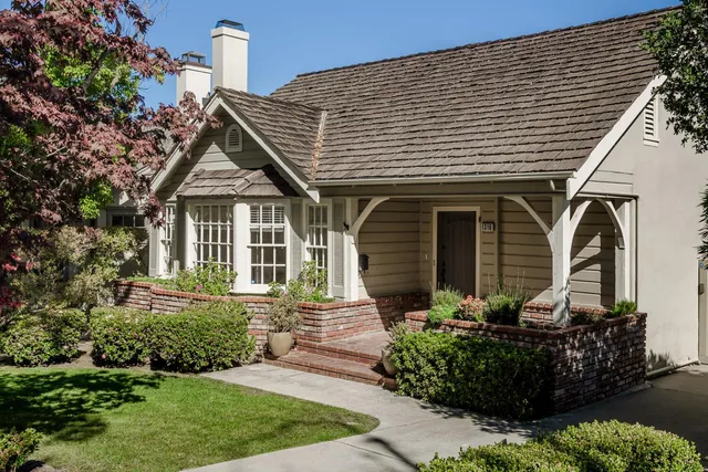 a front view of a house with garden