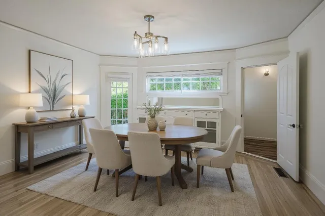 a view of a dining room with furniture window and wooden floor