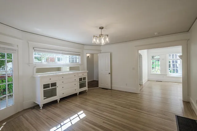 a view of a room with window and wooden floor