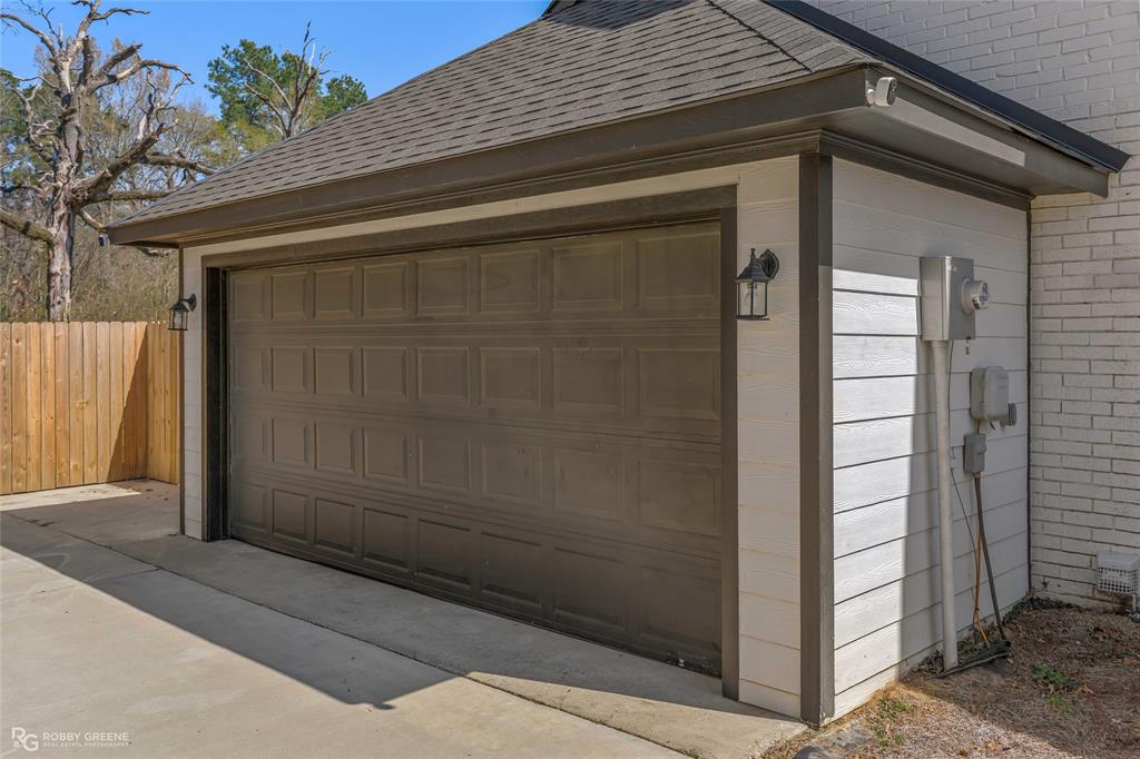 396 Collinswood Road Stonewall, LA 71078 - Photo 8 of 32 a side view of a house with a glass door