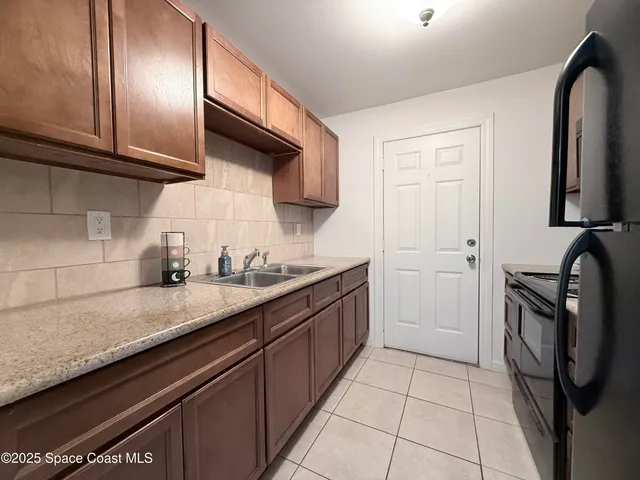 a kitchen with a stove and a microwave