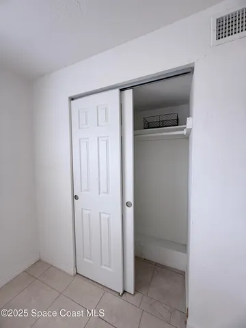 a bathroom with a granite countertop sink a toilet a mirror and bathtub
