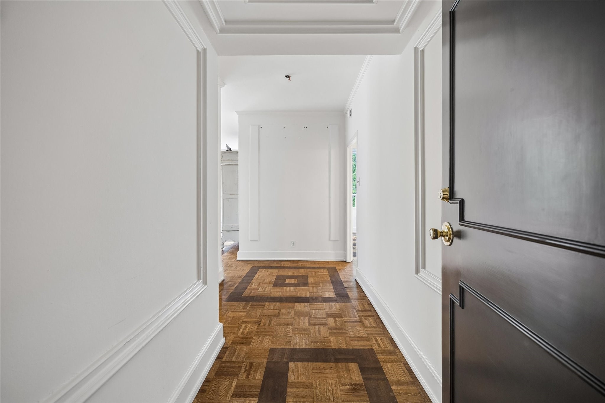 2701 Westheimer Road, Unit 2B Houston, TX 77098 - Photo 15 of 16 View from entry with French style parquet flooring and high ceilings through-out. Landlord will install a mutually agreed upon light fixture in the entry.