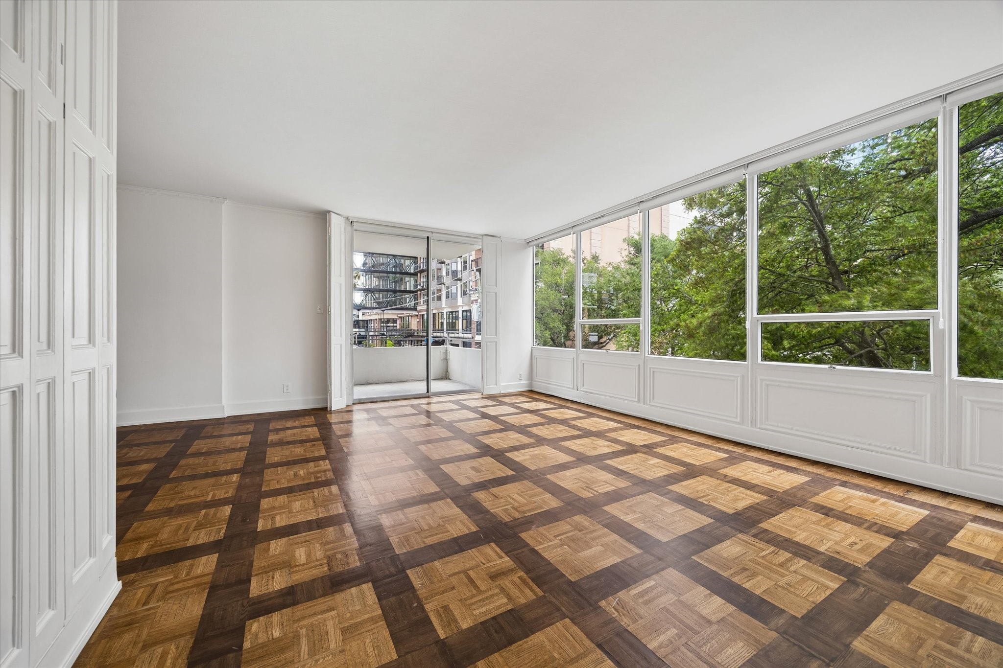 2701 Westheimer Road, Unit 2B Houston, TX 77098 - Photo 2 of 16 Living room with views towards the covered balcony.