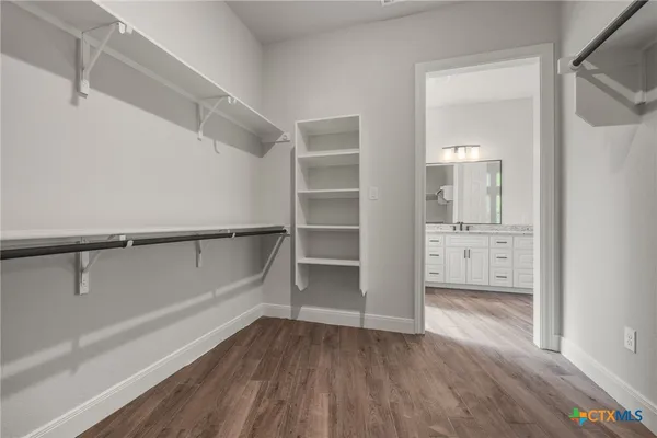 a view of an empty walk in closet