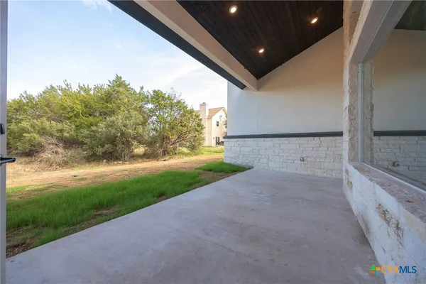 a view of a backyard of the house