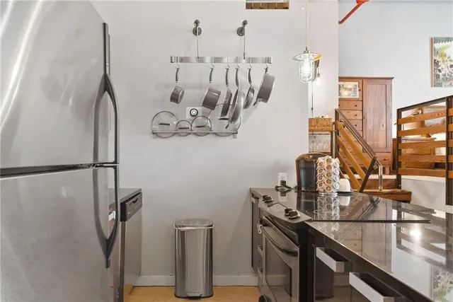 a kitchen with a sink and refrigerator