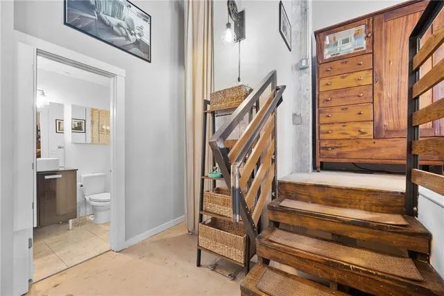 a view of an entryway with wooden floor