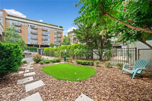 a view of a garden with a bench in patio