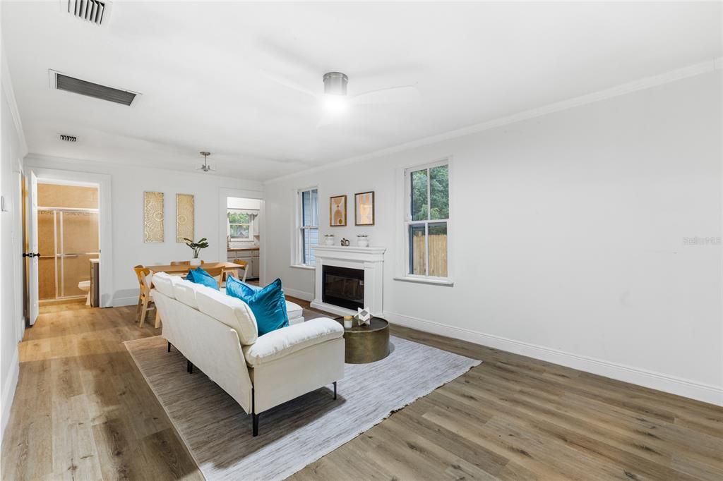 902 Northwest 4th Place Gainesville, FL 32601 - Photo 12 of 33 a living room with fireplace furniture and a wooden floor