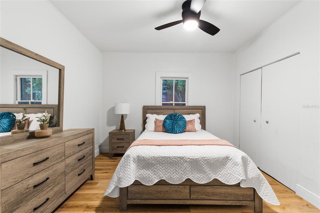 902 Northwest 4th Place Gainesville, FL 32601 - Photo 22 of 33 a bedroom with a bed and lamps