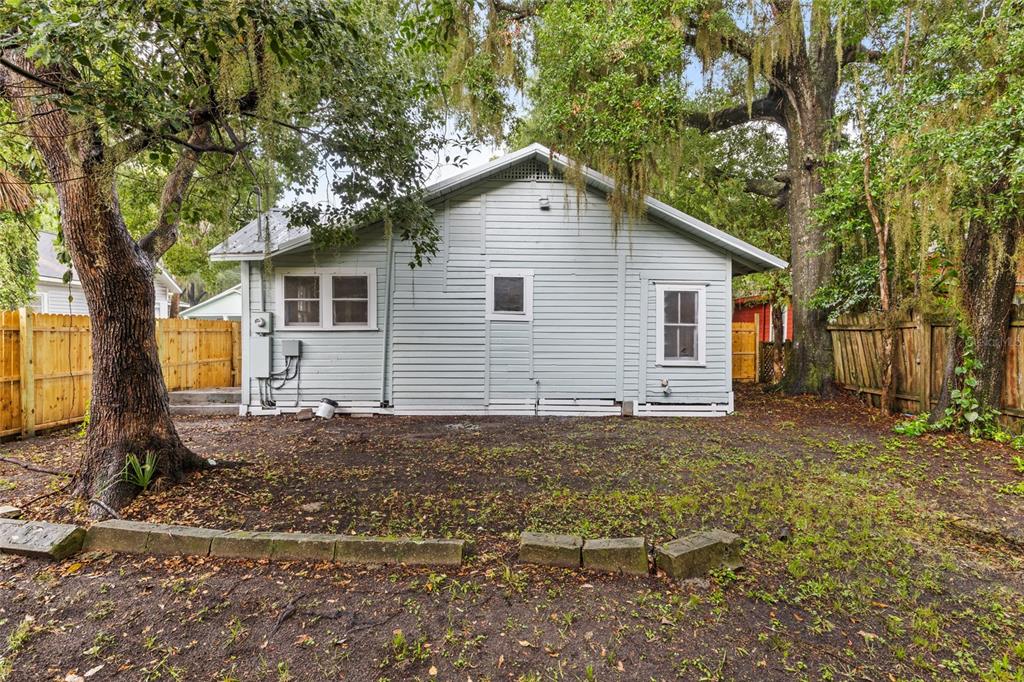 902 Northwest 4th Place Gainesville, FL 32601 - Photo 28 of 33 a view of a yard in front of a house with large trees