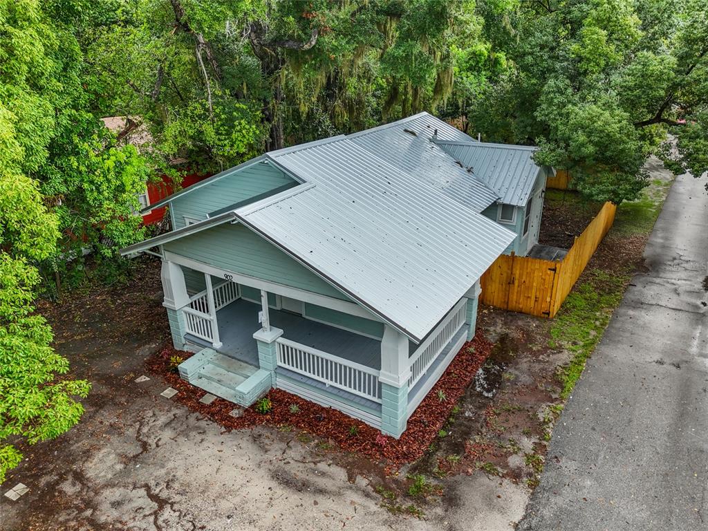 902 Northwest 4th Place Gainesville, FL 32601 - Photo 3 of 33 a view of a house with a yard and large trees