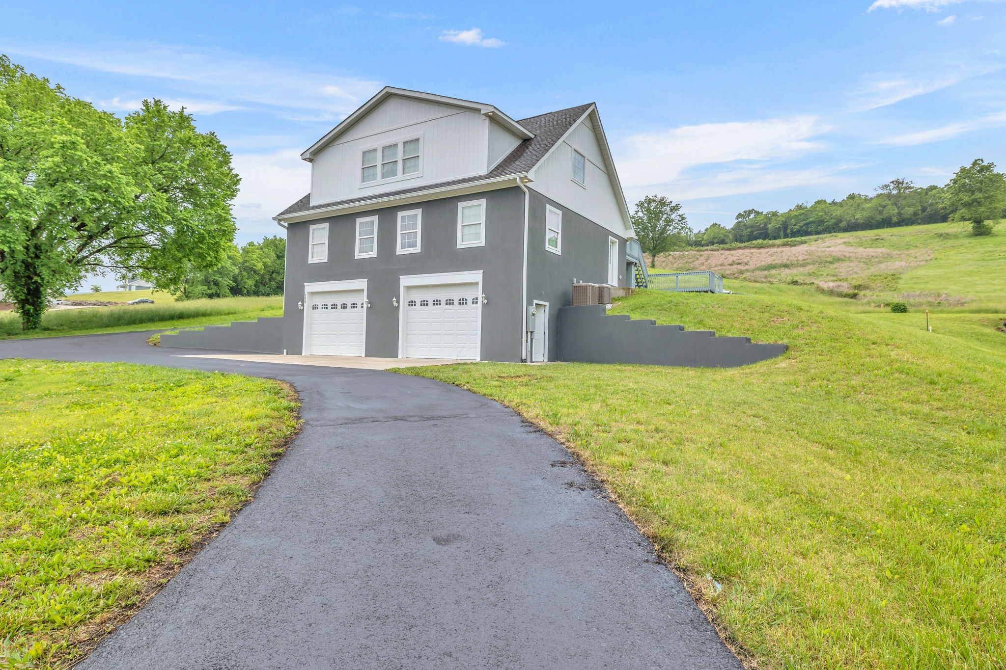 150 Hickman Highway Hickman, TN 38567 - Photo 1 of 42 a front view of a house with a yard and lake view