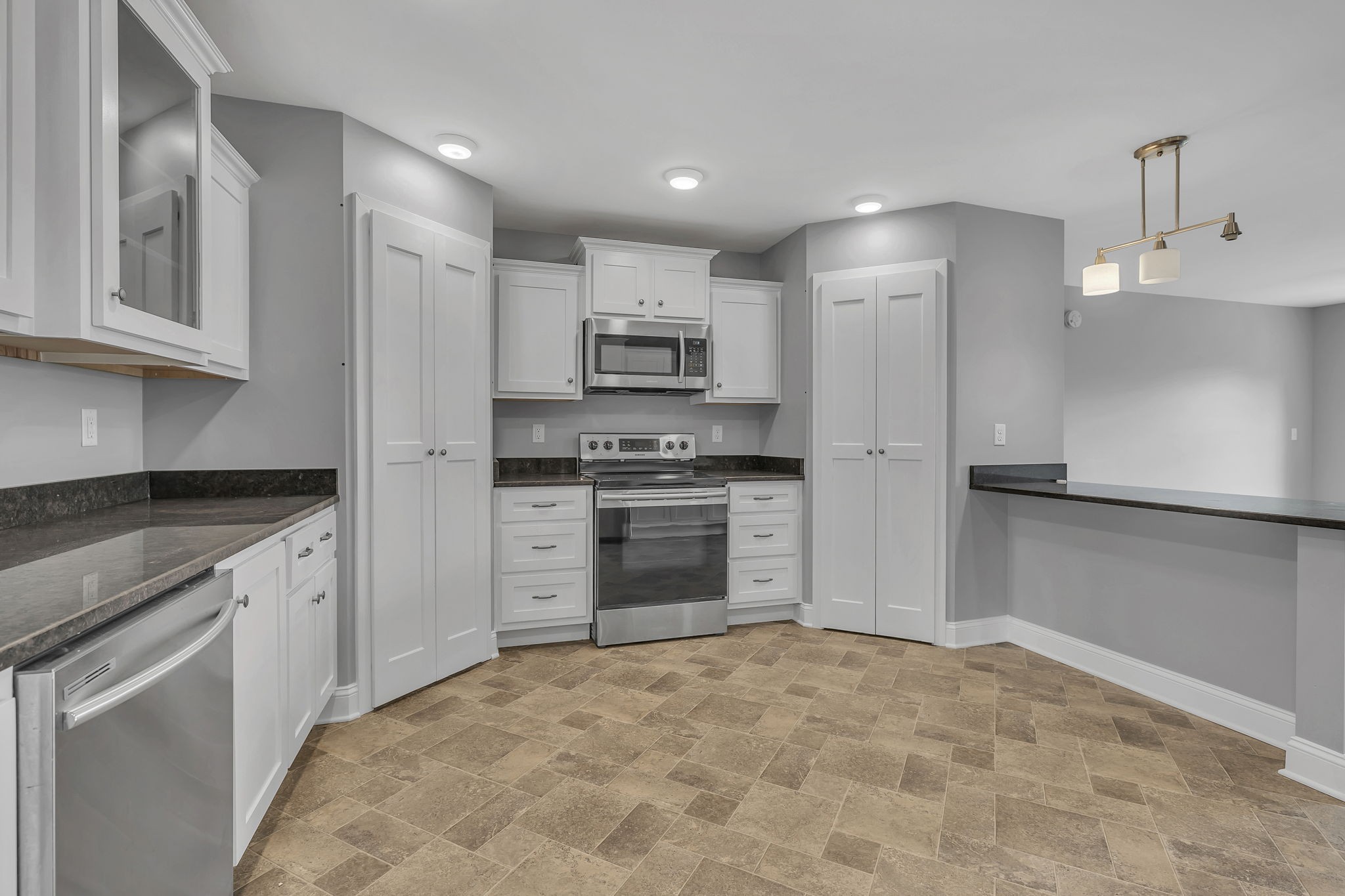 150 Hickman Highway Hickman, TN 38567 - Photo 11 of 42 a kitchen with kitchen island a stove a refrigerator and a sink