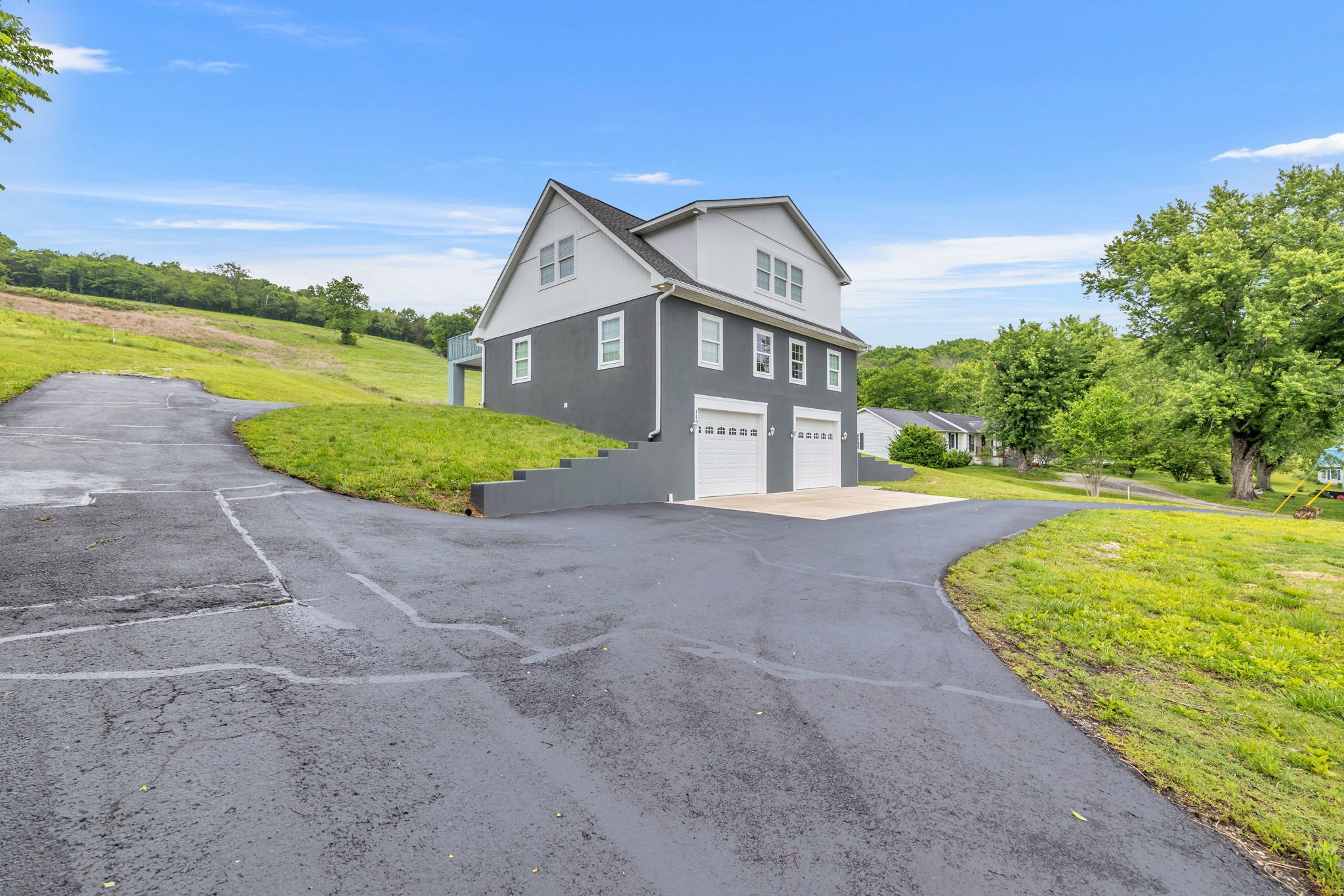 150 Hickman Highway Hickman, TN 38567 - Photo 2 of 42 a view of a house with a yard and potted plants