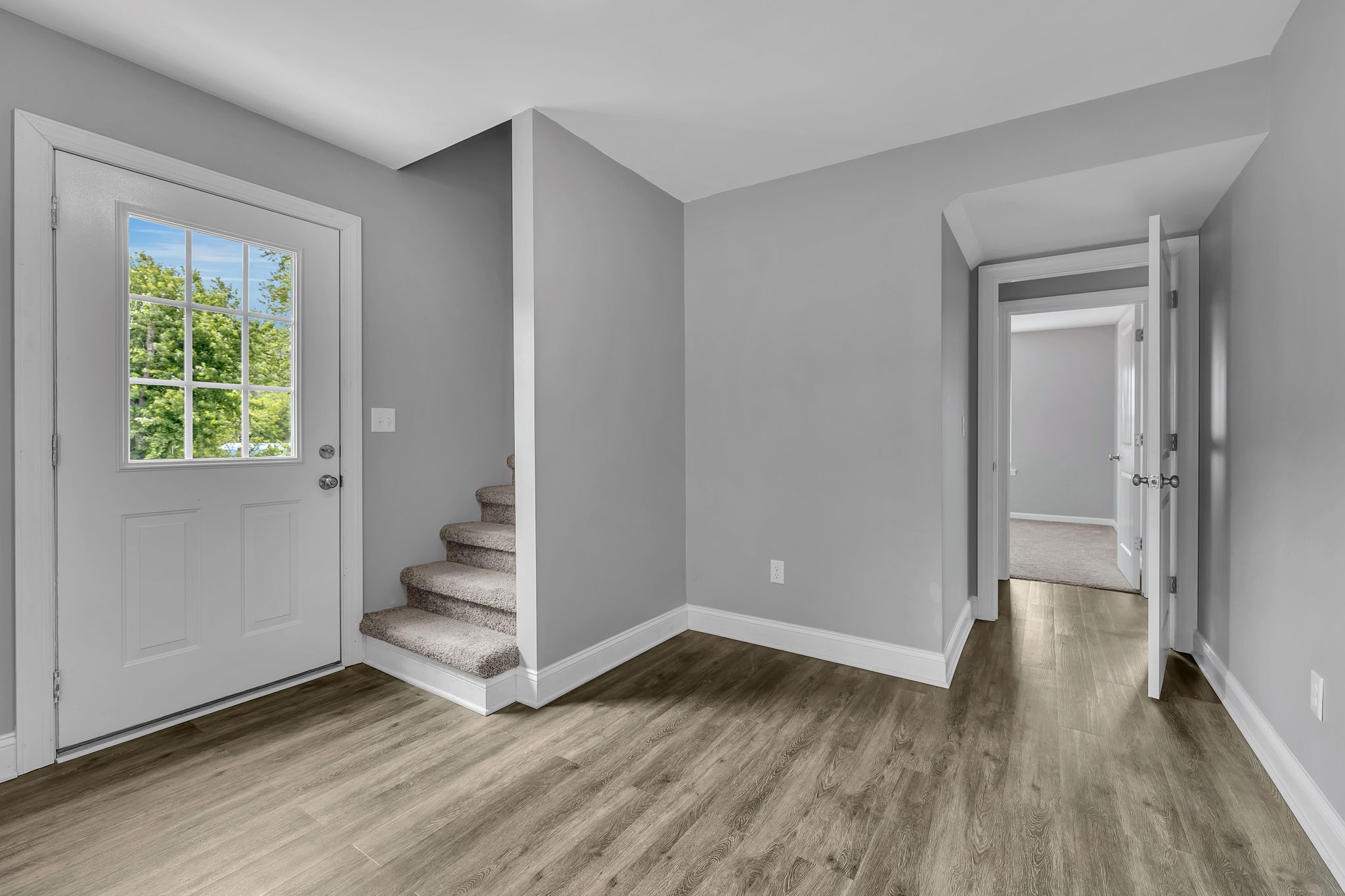 150 Hickman Highway Hickman, TN 38567 - Photo 21 of 42 an empty room with wooden floor and a window