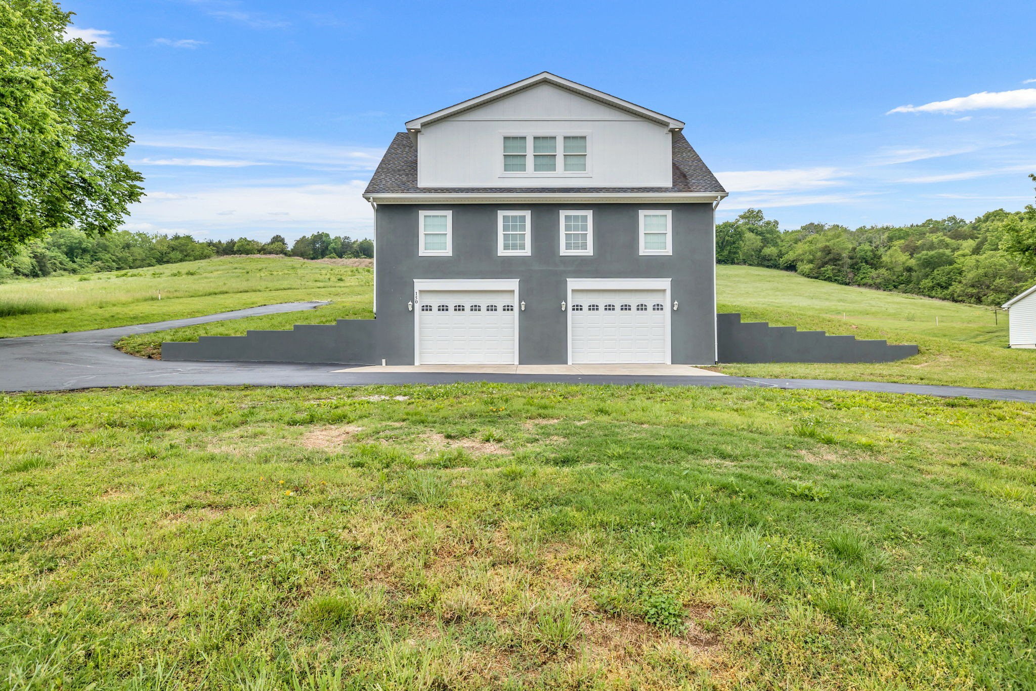 150 Hickman Highway Hickman, TN 38567 - Photo 3 of 42 a front view of a house with a yard