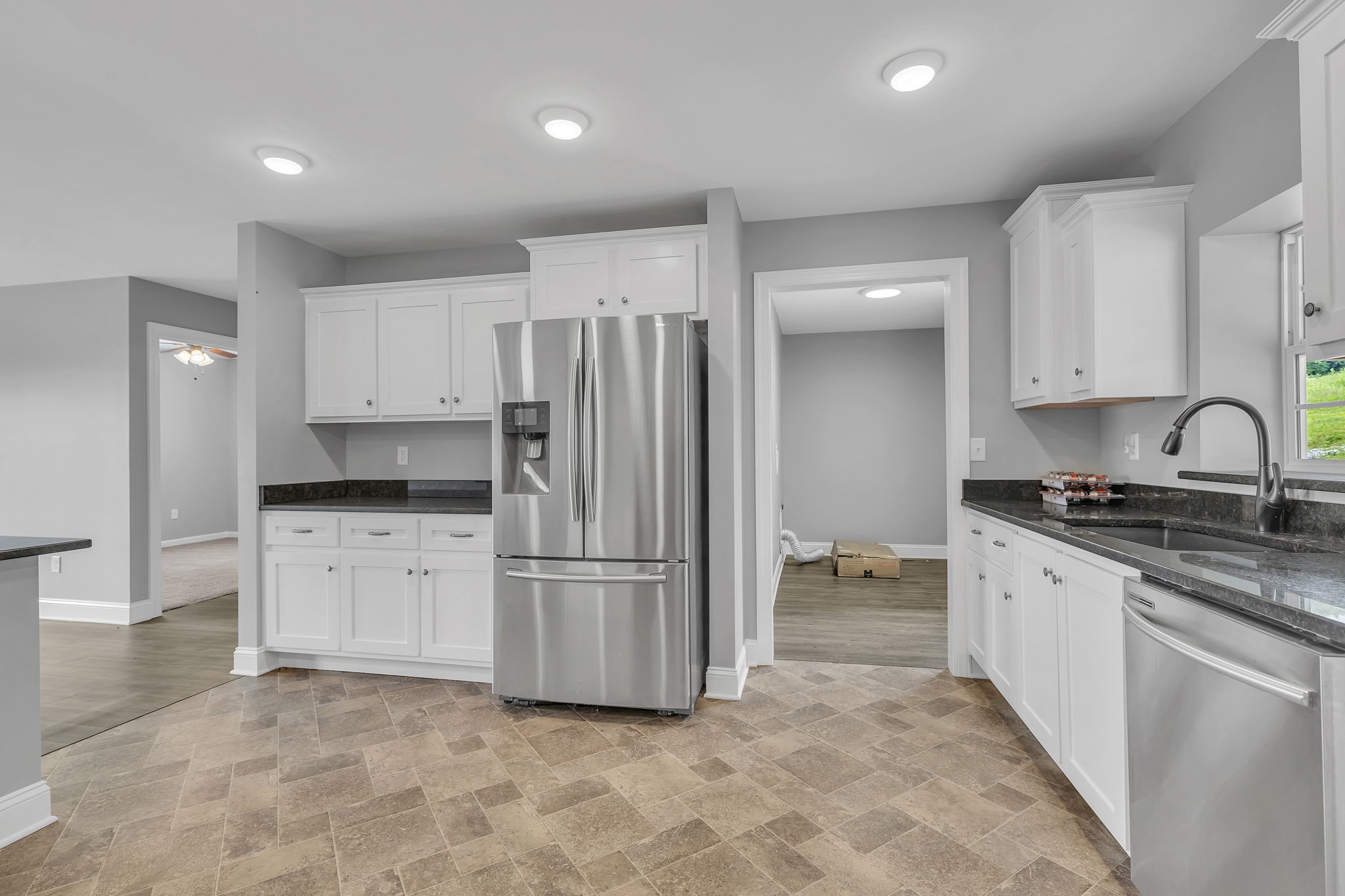 150 Hickman Highway Hickman, TN 38567 - Photo 9 of 42 a kitchen with granite countertop a refrigerator and a sink