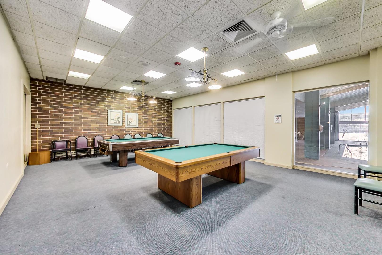 3925 Triumvera Drive, Unit 14D Glenview, IL 60025 - Photo 37 of 48 a room with pool table and furniture