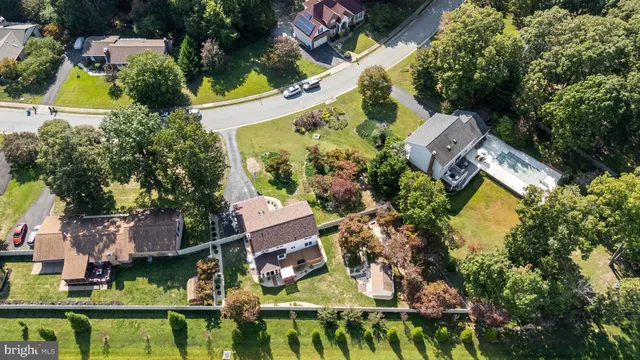 an aerial view of house with yard swimming pool and outdoor seating
