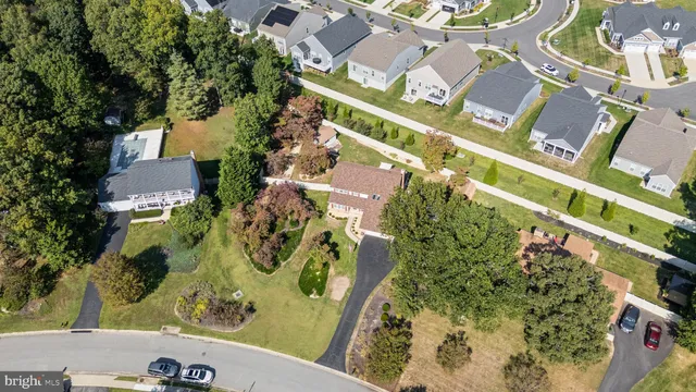 an aerial view of a residential apartment building with a yard
