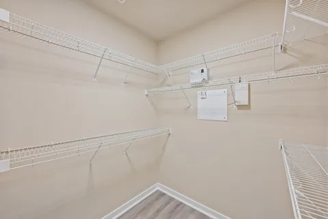 a view of storage and utility room with racks on the wall