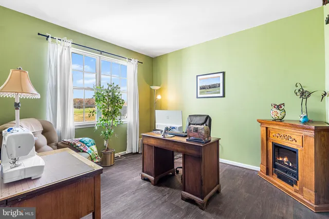 a livingroom with furniture and a fireplace