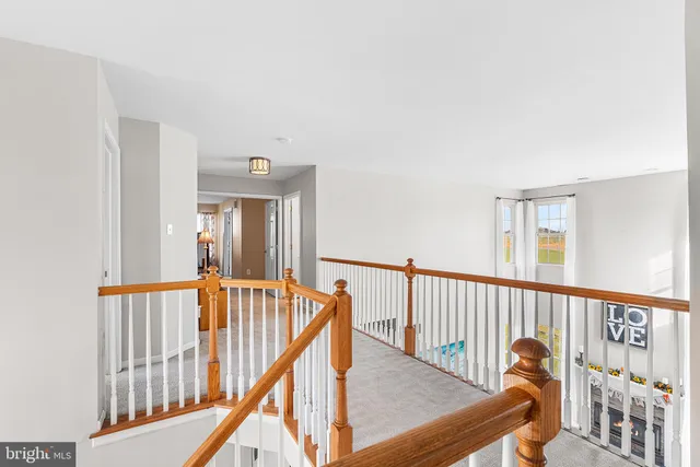 a view of a balcony with furniture and stairs