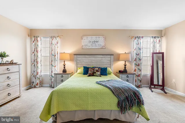 a bedroom with a bed and a table