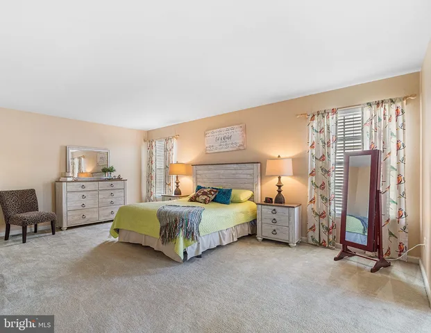 a bedroom with bed and window