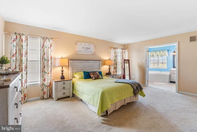 a bedroom with a bed and a cabinets