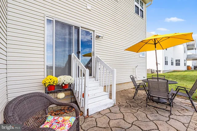 a view of a lounge chairs in back of the house
