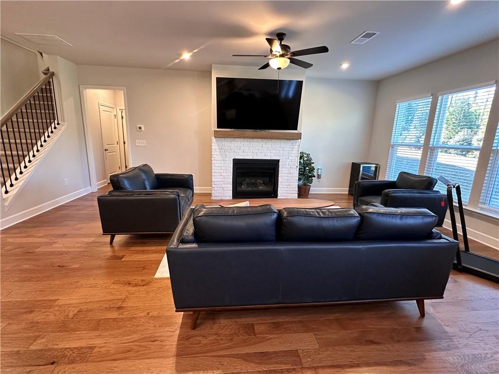 5430 Wheeler Ridge Road Auburn, GA 30011 - Photo 13 of 32 a living room with furniture and a flat screen tv