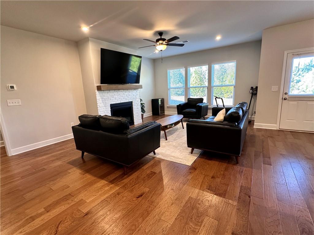 5430 Wheeler Ridge Road Auburn, GA 30011 - Photo 16 of 32 a living room with fireplace furniture and a flat screen tv