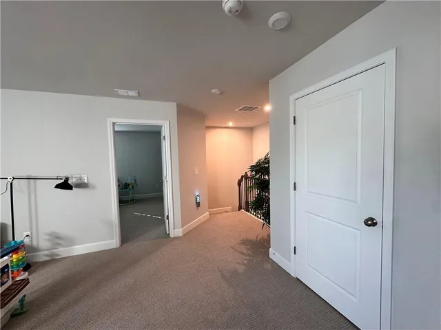 a view of a room with a furniture and a mirror