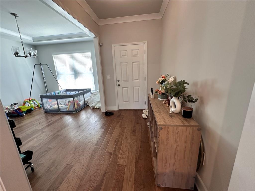 5430 Wheeler Ridge Road Auburn, GA 30011 - Photo 2 of 32 a view of a hallway with wooden floor and a potted plant