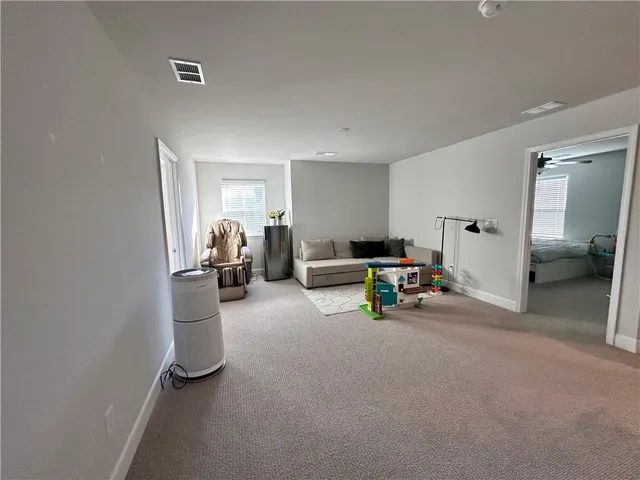 a view of a livingroom with furniture and a livingroom