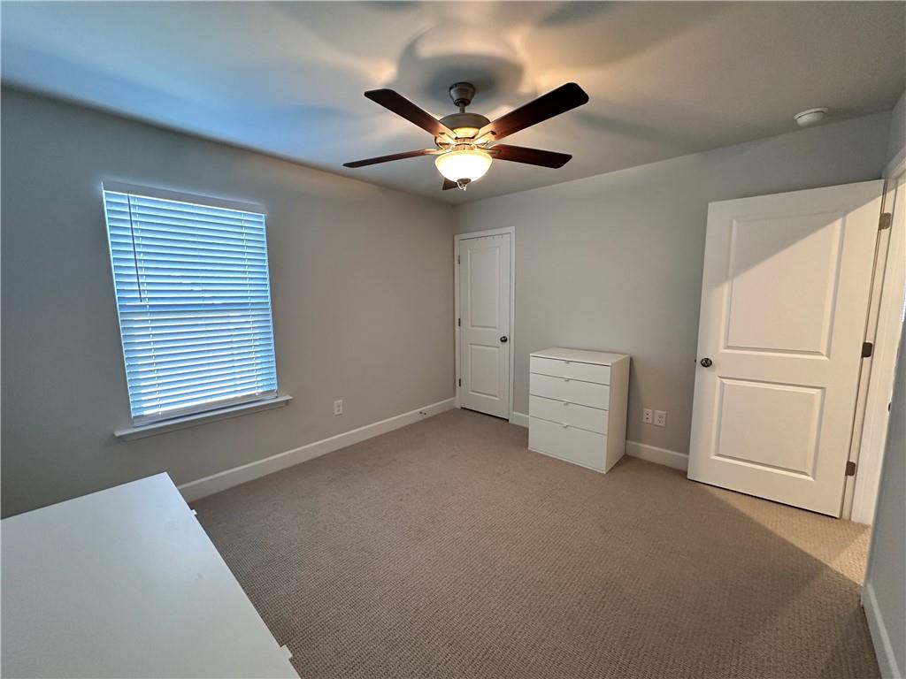 5430 Wheeler Ridge Road Auburn, GA 30011 - Photo 25 of 32 a view of a livingroom with a ceiling fan and window