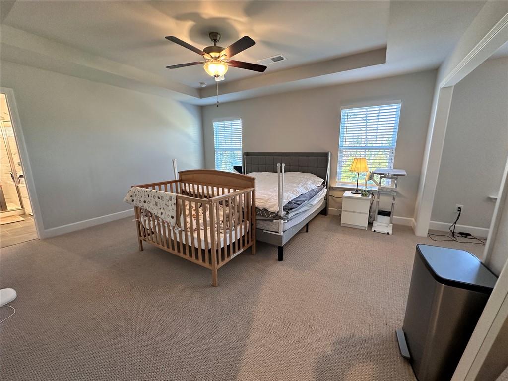 5430 Wheeler Ridge Road Auburn, GA 30011 - Photo 26 of 32 a room with a bed window and a couch